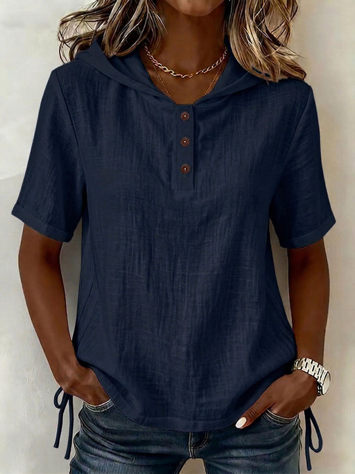 Modern women's long-sleeve hooded button-up shirt in a relaxed fit, great for versatile everyday style.