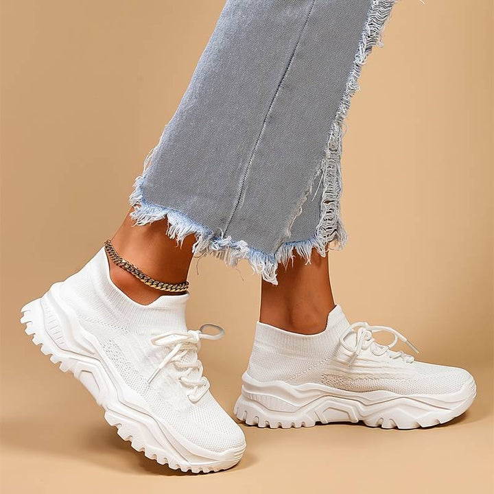 Versatile women's lace-up sneakers with a trendy chunky sole, ideal for casual wear & comfortable walking.