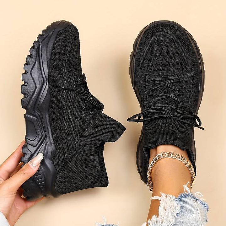 Stylish women's comfortable sneakers featuring a modern chunky sole & secure lace-up closure for everyday wear.