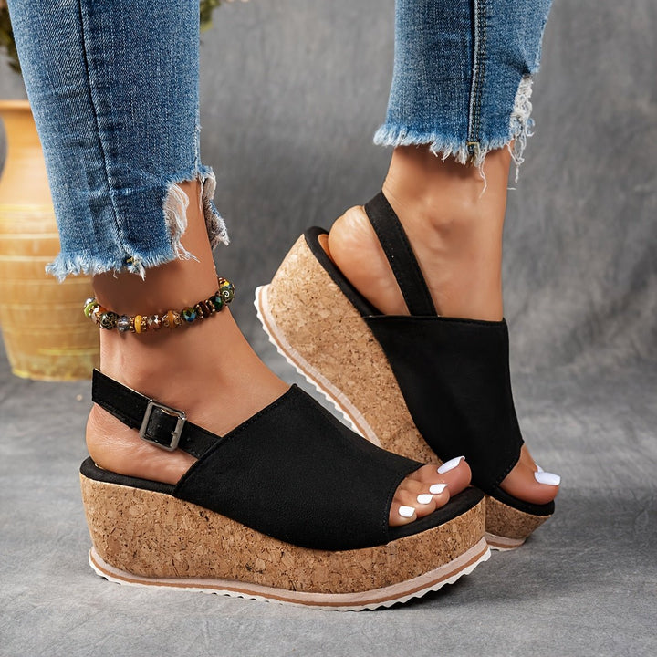 Fashionable women's open-toe leopard print platform wedge sandals, perfect for summer outfits.