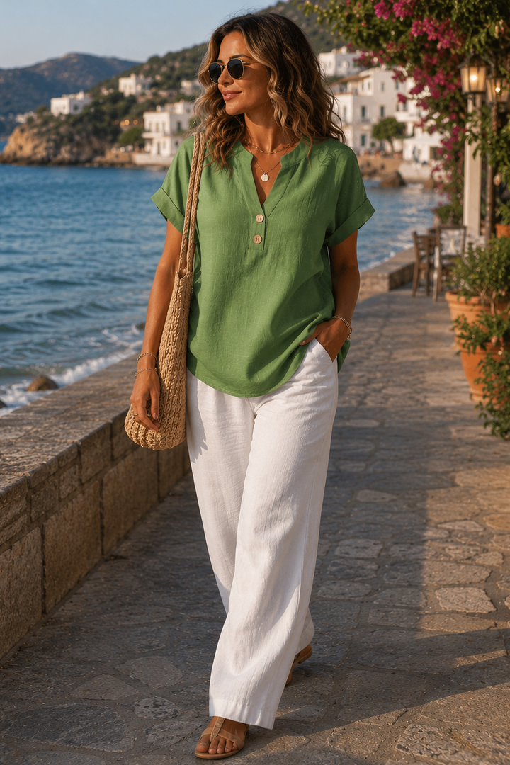 Stylish women's casual long sleeve shirt. Features elegant button accents, perfect for various occasions.