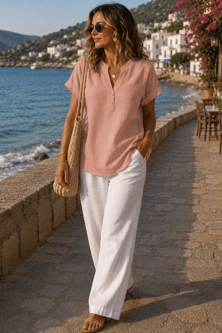 Fashionable women's top with intricate button details. Offers a comfortable, versatile style for any look.