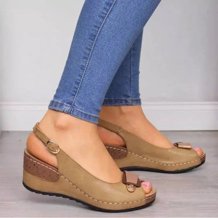 Casual women's open toe slip-on wedge sandals with an adjustable slingback strap for summer comfort.