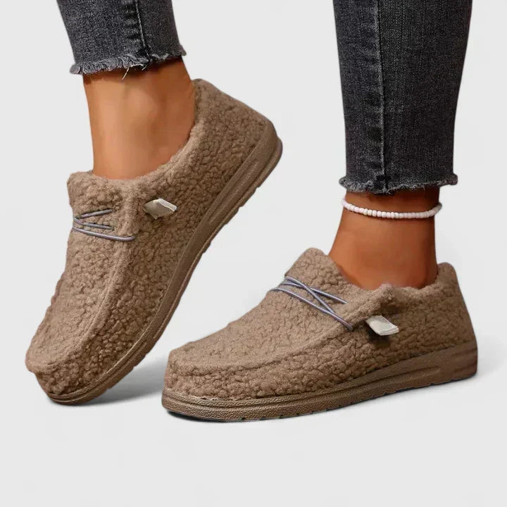 Women's comfortable orthopedic loafers in black, providing all-day foot support and pain relief for walking.