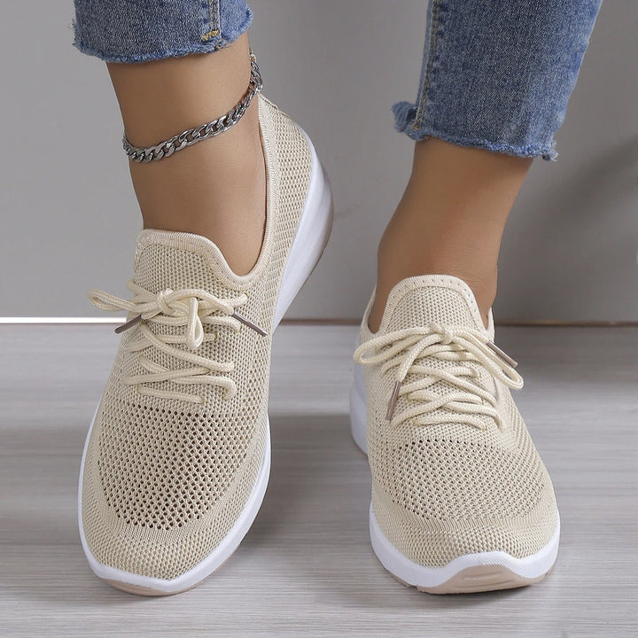 Ladies' athletic wedge sneakers with a comfortable platform, ideal for casual & everyday wear.