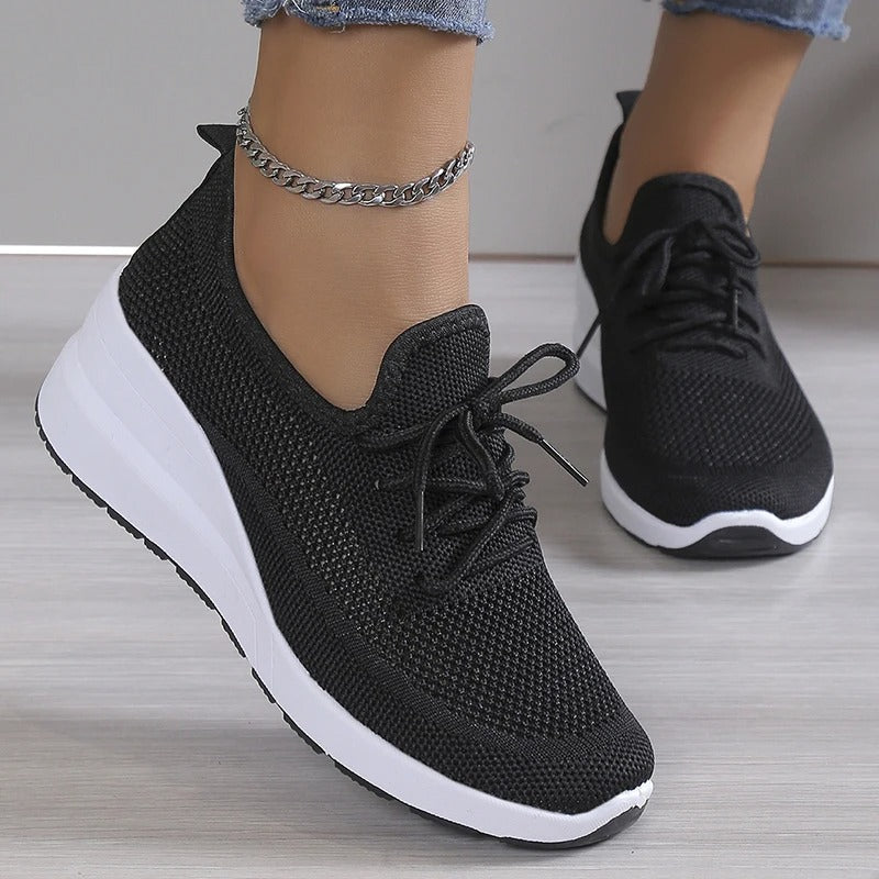 Women's fashionable platform wedge sneakers, offering comfort & a stylish boost for any outfit.