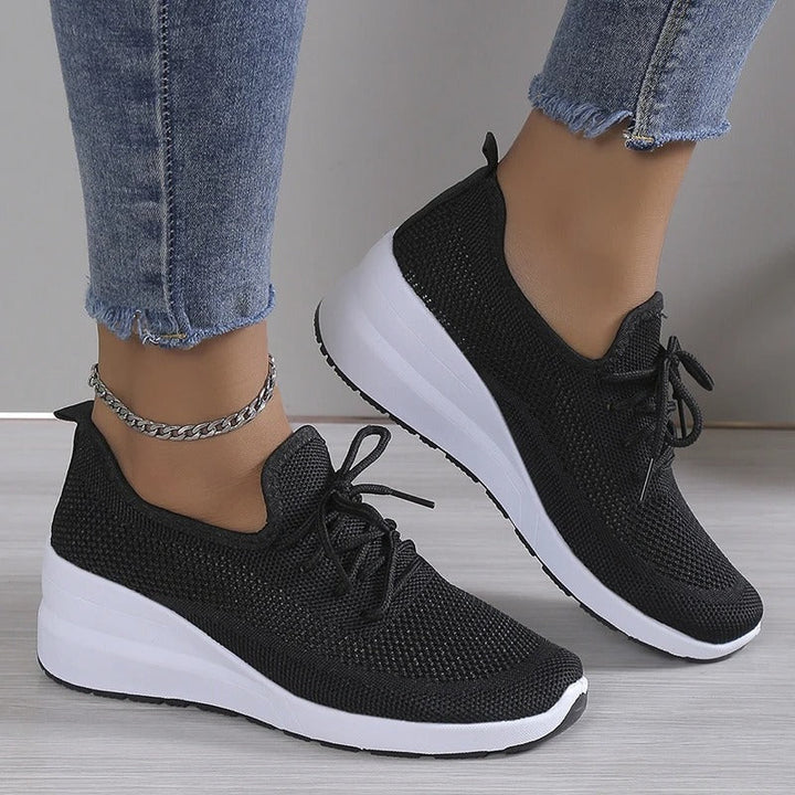 Comfortable women's platform wedge athletic shoes, versatile for casual wear & stylish ensembles.