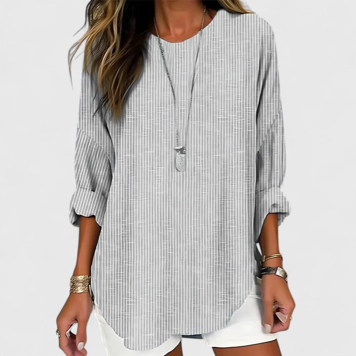 Chic women's striped long sleeve blouse with crew neck. Comfortable and versatile relaxed fit top for everyday fashion.