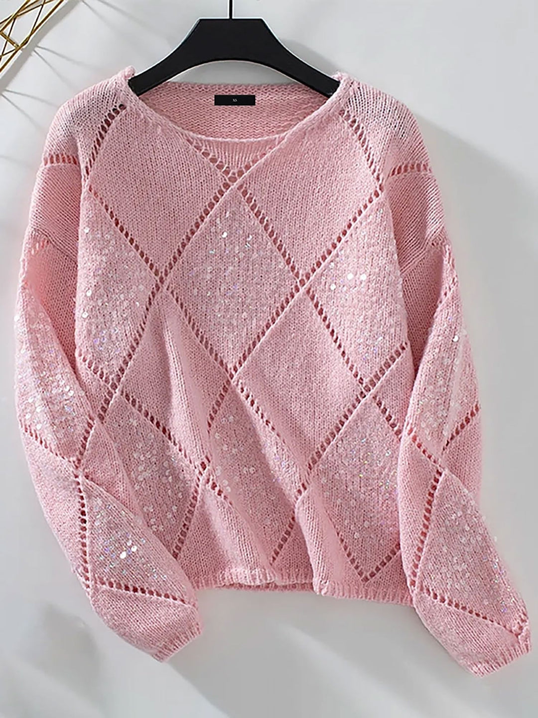 Chic holiday fashion women's sequin sweater, comfortable relaxed fit with sparkling diamond pattern. Elegant top.