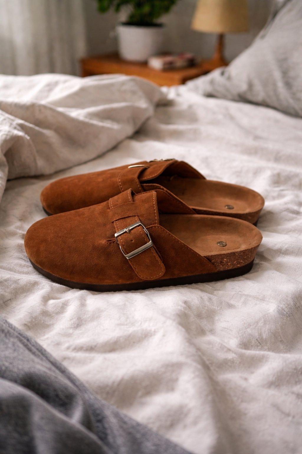 Fashionable women's open-heel clogs with an adjustable buckle strap, perfect for versatile everyday style.