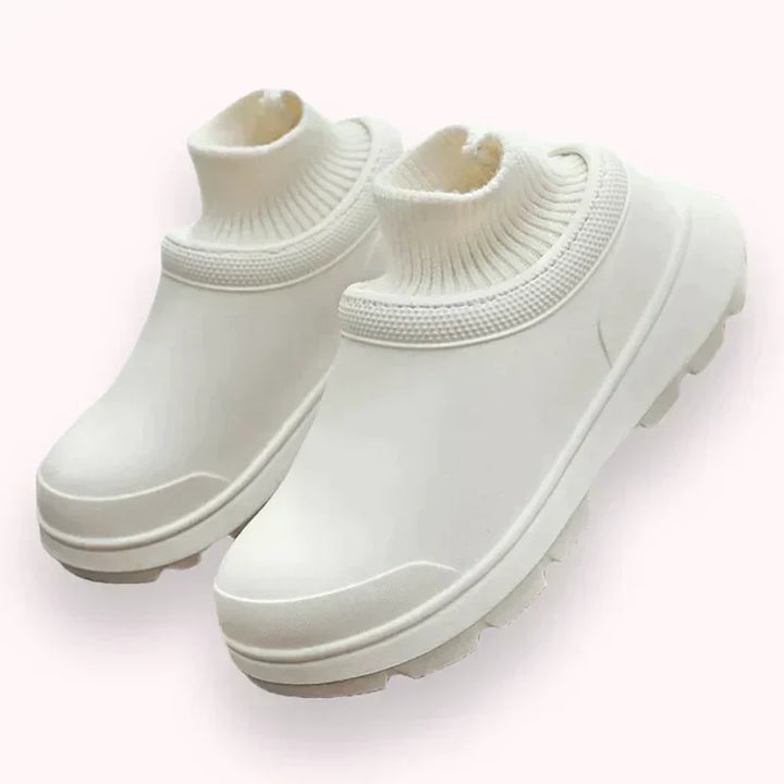 Women's comfortable slip-on clogs with secure knit ankle cuff. Ideal for casual everyday wear.