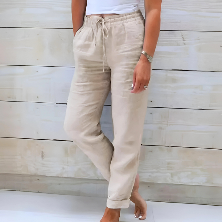 Relaxed fit women's straight leg pants featuring an elastic drawstring waist, ideal for everyday comfort & chic style.
