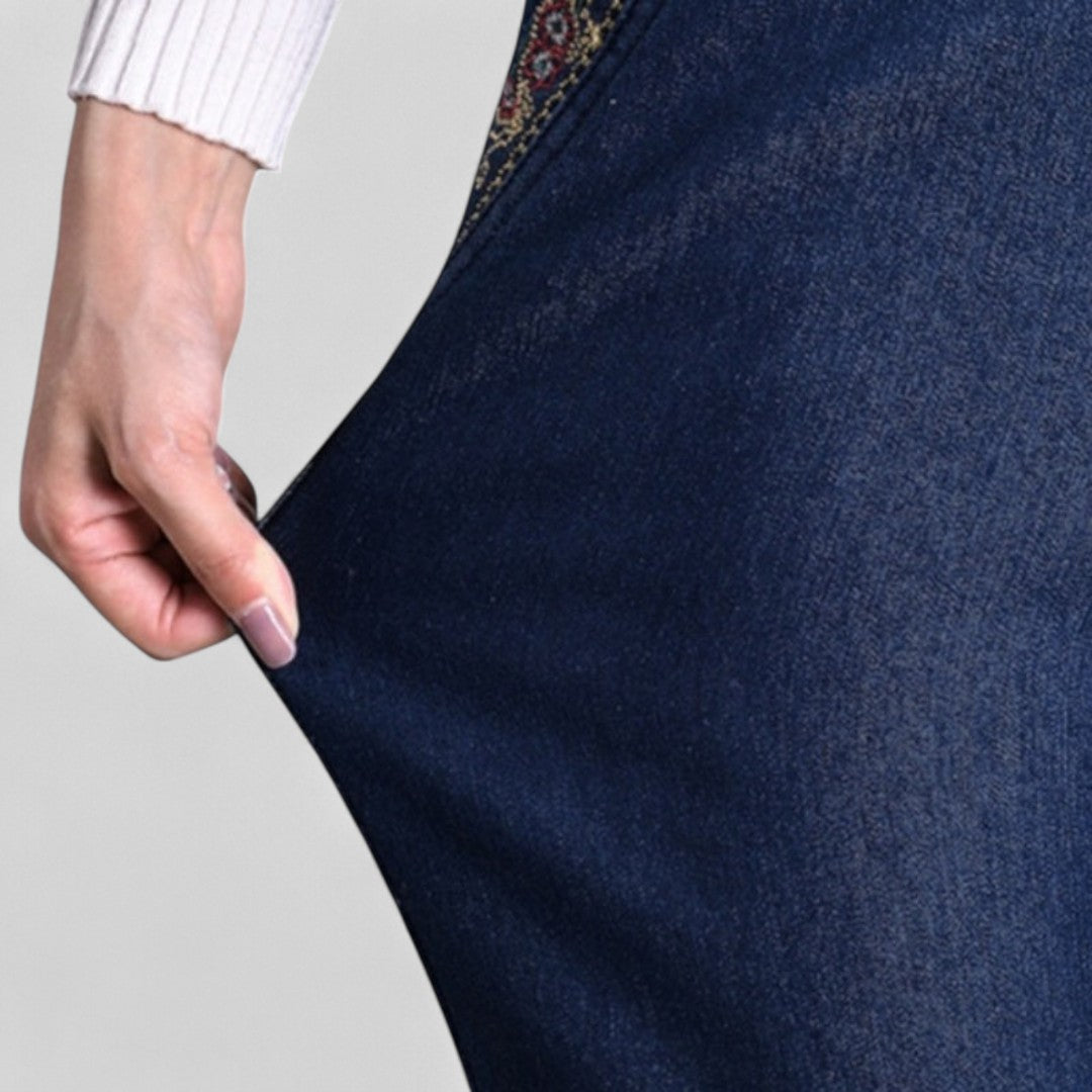 Stylish women's stretch jeans with elastic waist, functional pockets, and a relaxed comfortable fit.