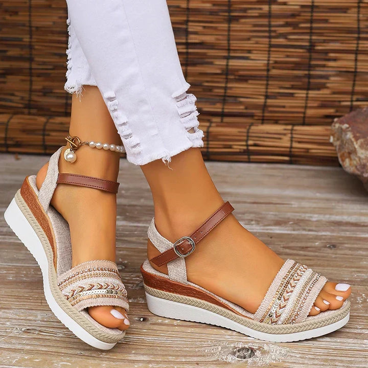 Flat women's summer sandals, comfortable with adjustable strap, ideal for boho chic vacation footwear.