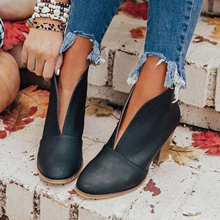 Chic women's slip-on V-cut ankle boots for versatile casual style and winter comfort.