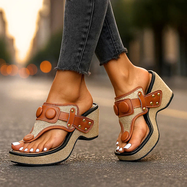 Women's white summer wedge sandals, platform thong style providing comfort and arch support for daily wear.