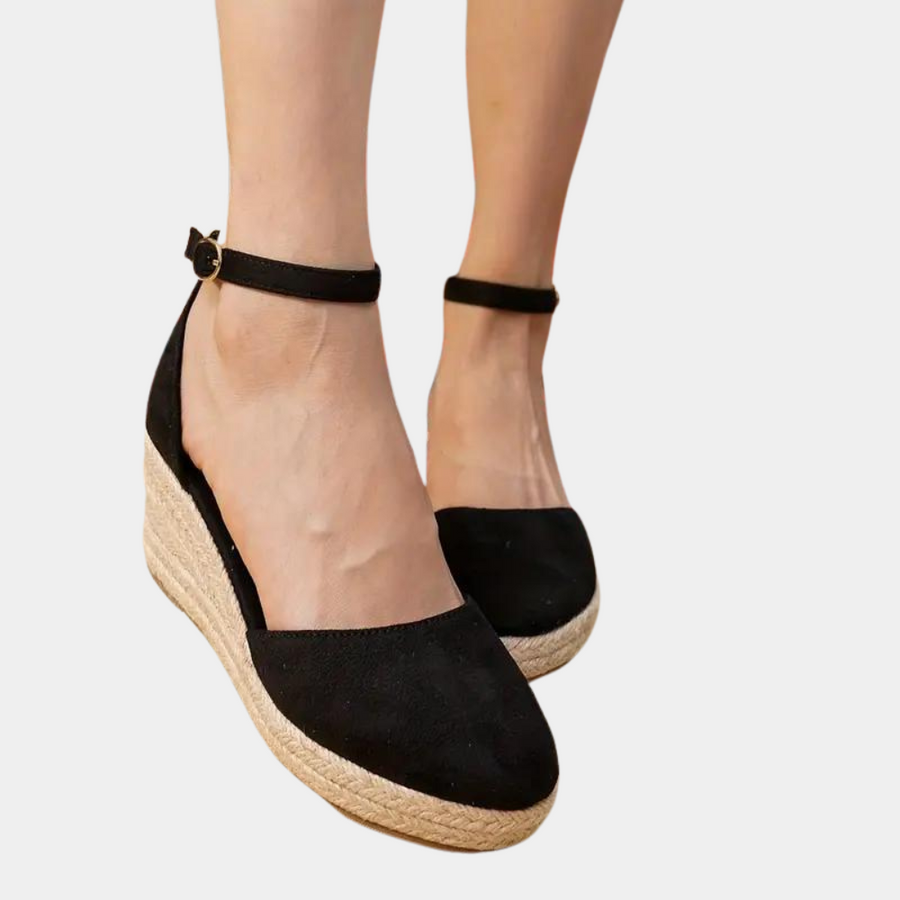 Stylish women's wedge sandals featuring a supportive wedge heel & adjustable ankle strap for versatile wear.