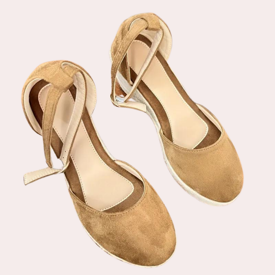 Comfortable women's Alina wedge sandals with adjustable ankle strap, blending style with everyday ease.