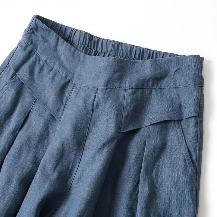 Pleated wide leg summer pants for women, featuring a comfortable loose fit & high elastic waist. Relaxed casual style.