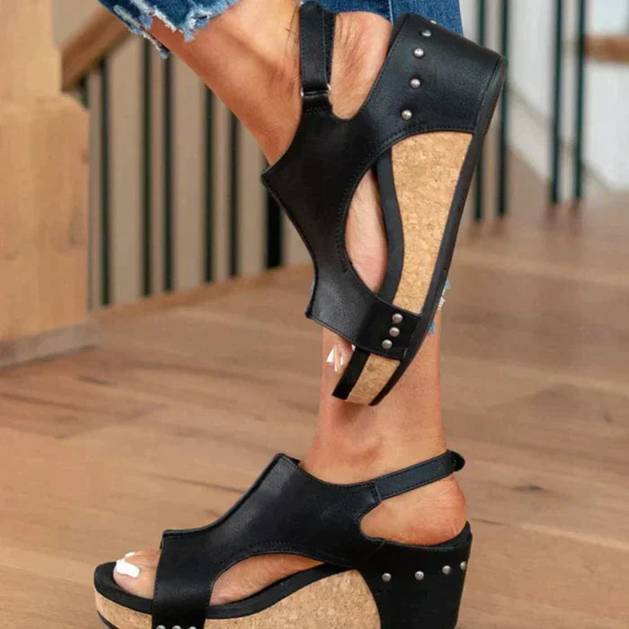 Orthopedic women's sandals featuring a comfortable wedge heel, arch support, and adjustable strap design.