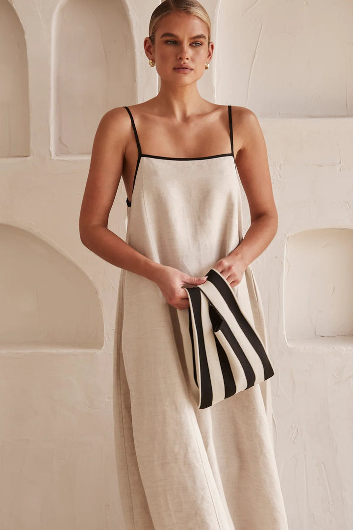 Elegant women's flowy spaghetti strap maxi dress, square neck with stylish contrast trim. Ideal for summer.