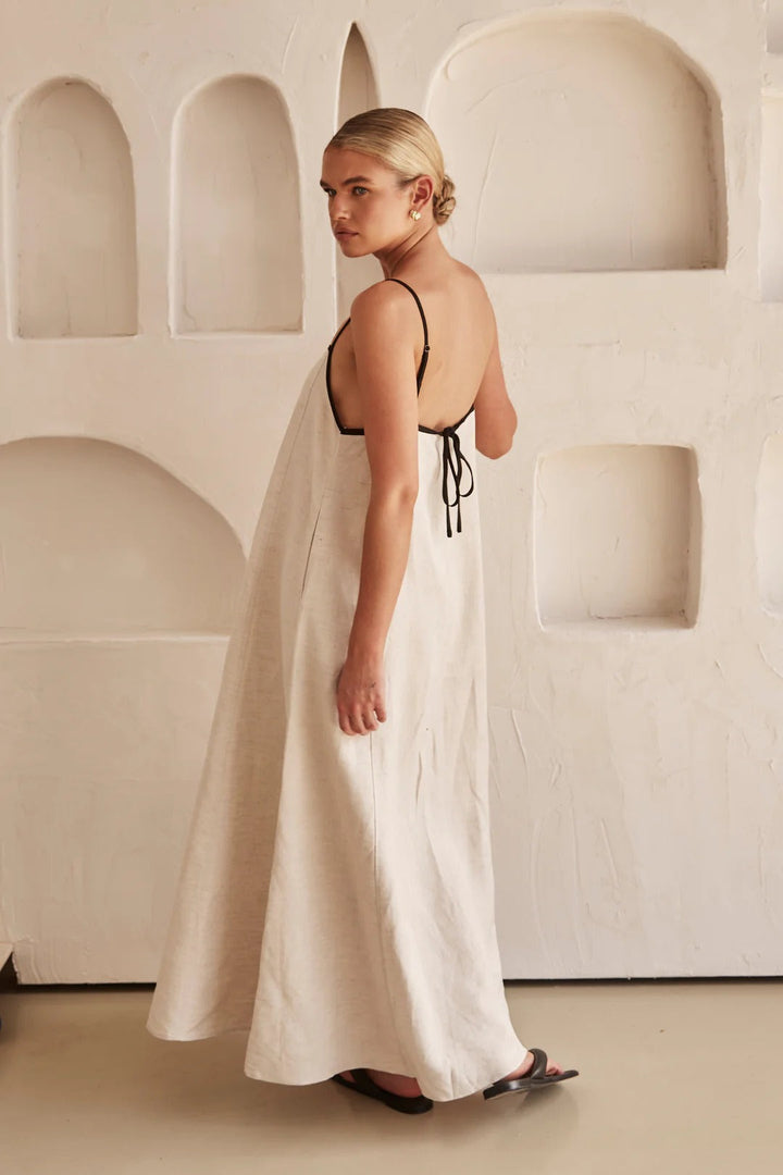Women's spaghetti strap maxi dress with a sophisticated square neck and decorative contrast trim. Summer elegant.
