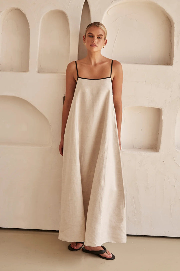 Flowy women's long maxi dress, spaghetti straps, square neckline & elegant contrast trim for a summer look.
