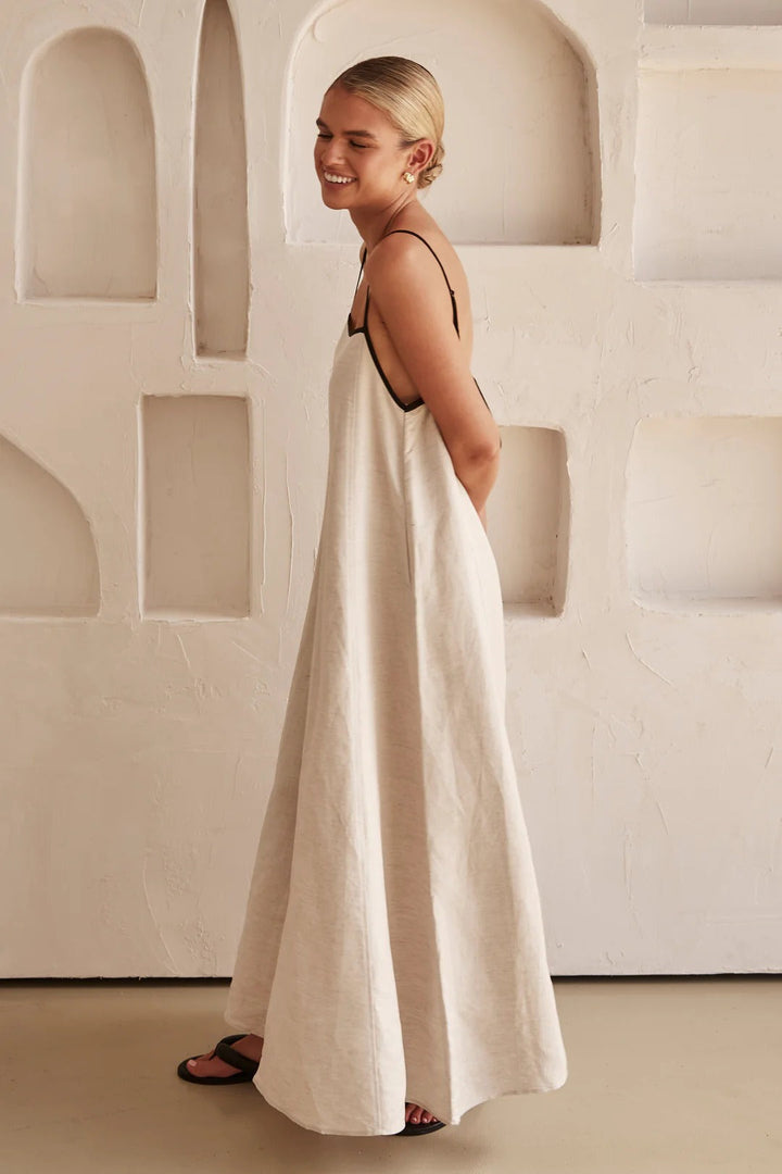 Casual elegant women's maxi dress, spaghetti straps, square neck, and distinctive contrast trim detail.
