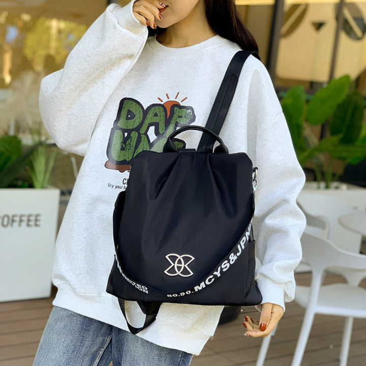 Women's convertible anti-theft backpack, sleek design for travel & commute. Secure main compartment, stylish everyday bag.