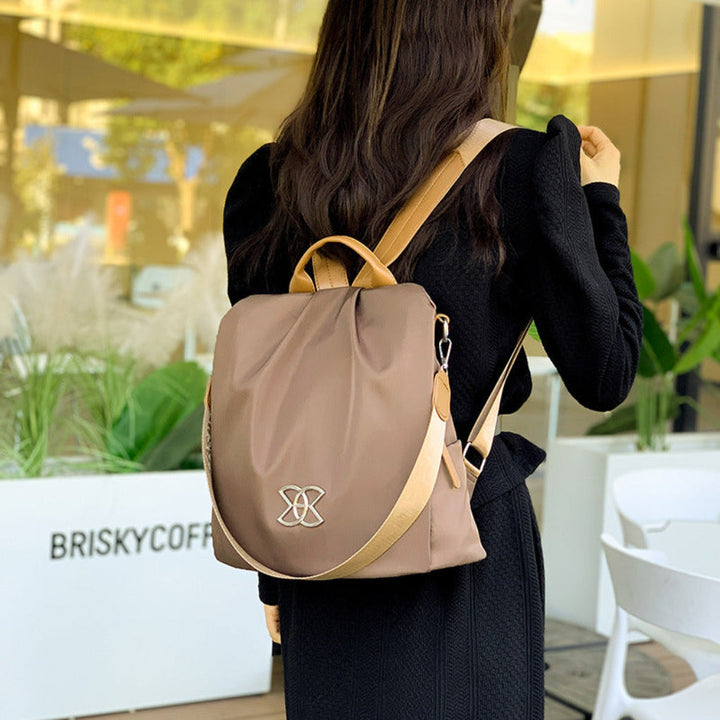 Chic women's anti-theft backpack, easily converts to shoulder bag. Secure pockets for commute, travel, & daily use.