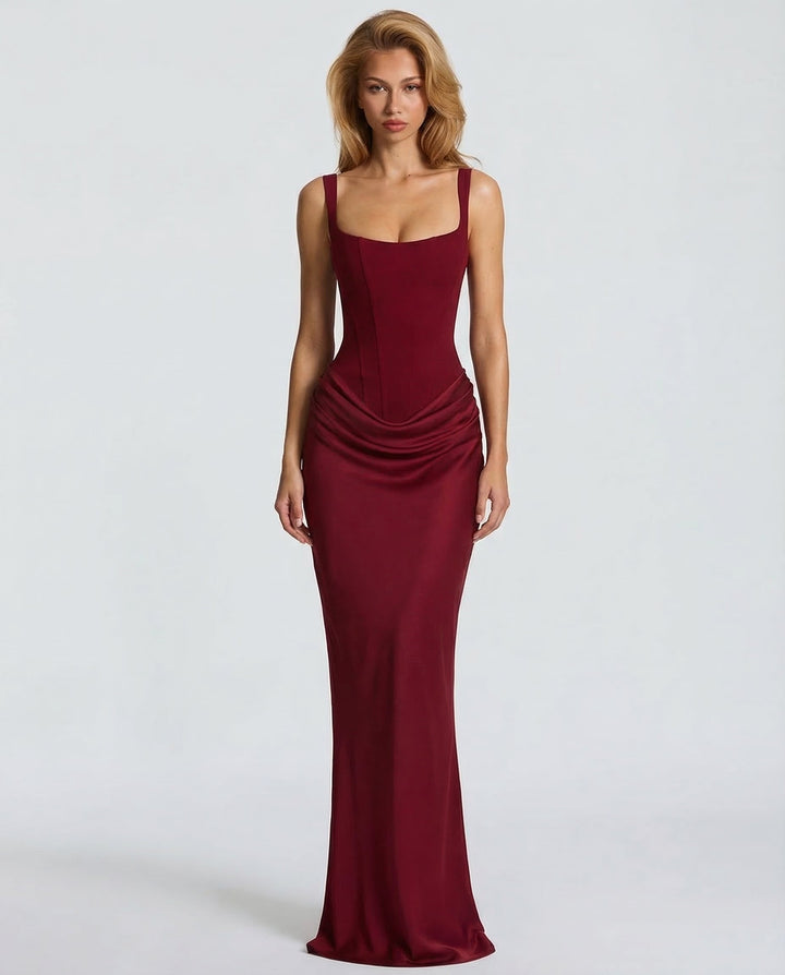 Formal women's corset maxi dress with a sleek sculpted silhouette, elegant draped waist, and square neck design.