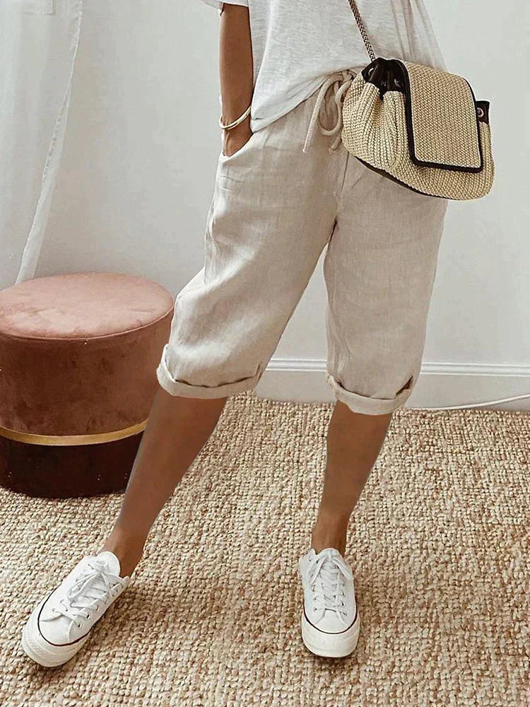 Relaxed fit women's cotton capri pants with drawstring waist & roll hem. Comfortable summer casual bottoms.