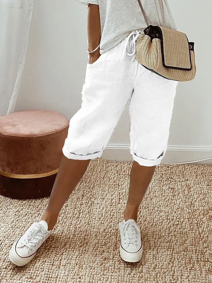 Soft cotton capri pants for women, featuring a drawstring waist & roll hem for ultimate casual summer comfort.