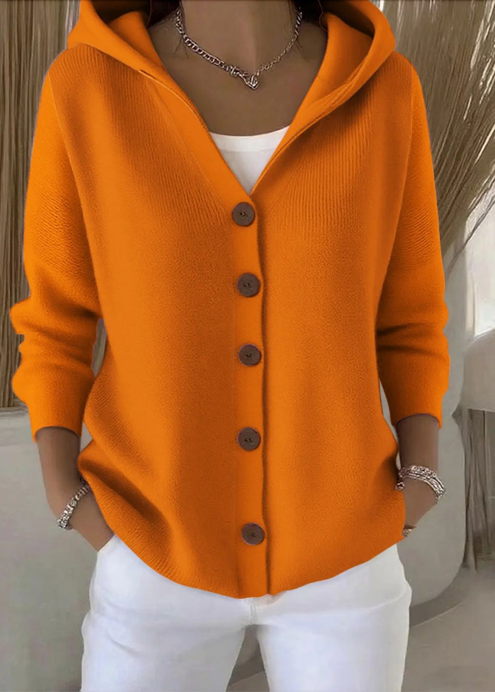 Cozy hooded button-up cardigan for women, a versatile long sleeve winter layer.