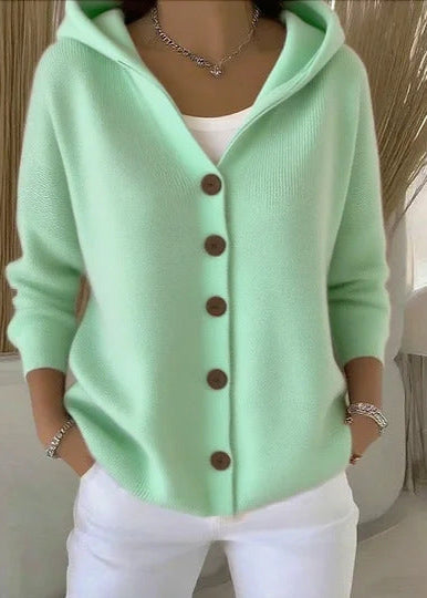 Soft knit women's button-up cardigan, featuring a hood and long sleeves for cozy style.