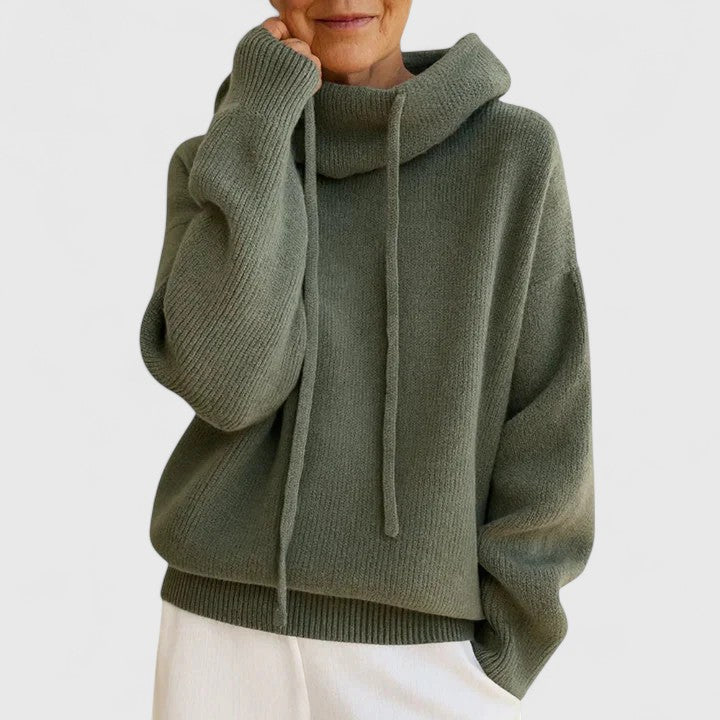 Women's cozy drawstring cowl neck pullover sweater in an oversized fit, perfect for fall and winter style.