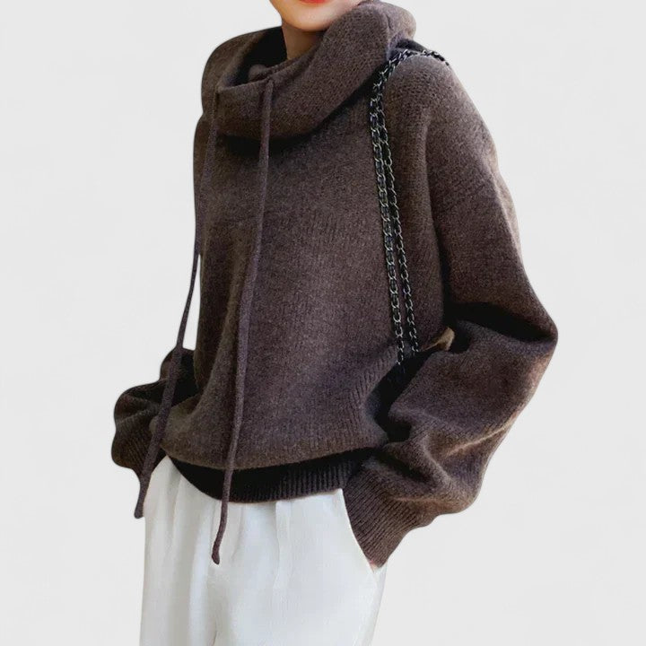 Soft women's pullover sweater featuring a stylish drawstring cowl neck, offering an oversized and cozy fit.