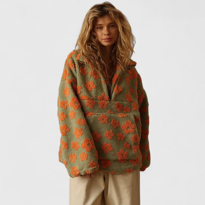 Warm women's quarter-zip pullover featuring a beautiful floral pattern and cozy fit.