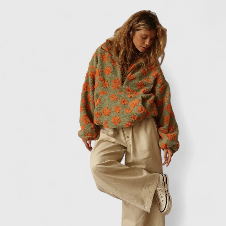 Fashionable women's floral quarter-zip pullover, a cozy sweater for cool weather.