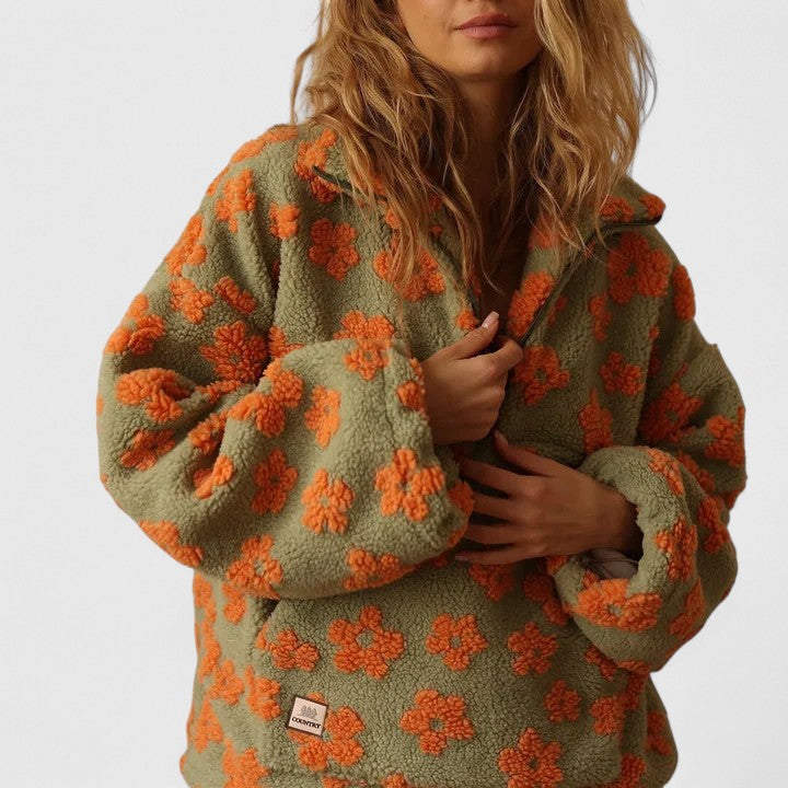 Women's cozy quarter-zip sweater with elegant floral print, ideal for casual autumn style.