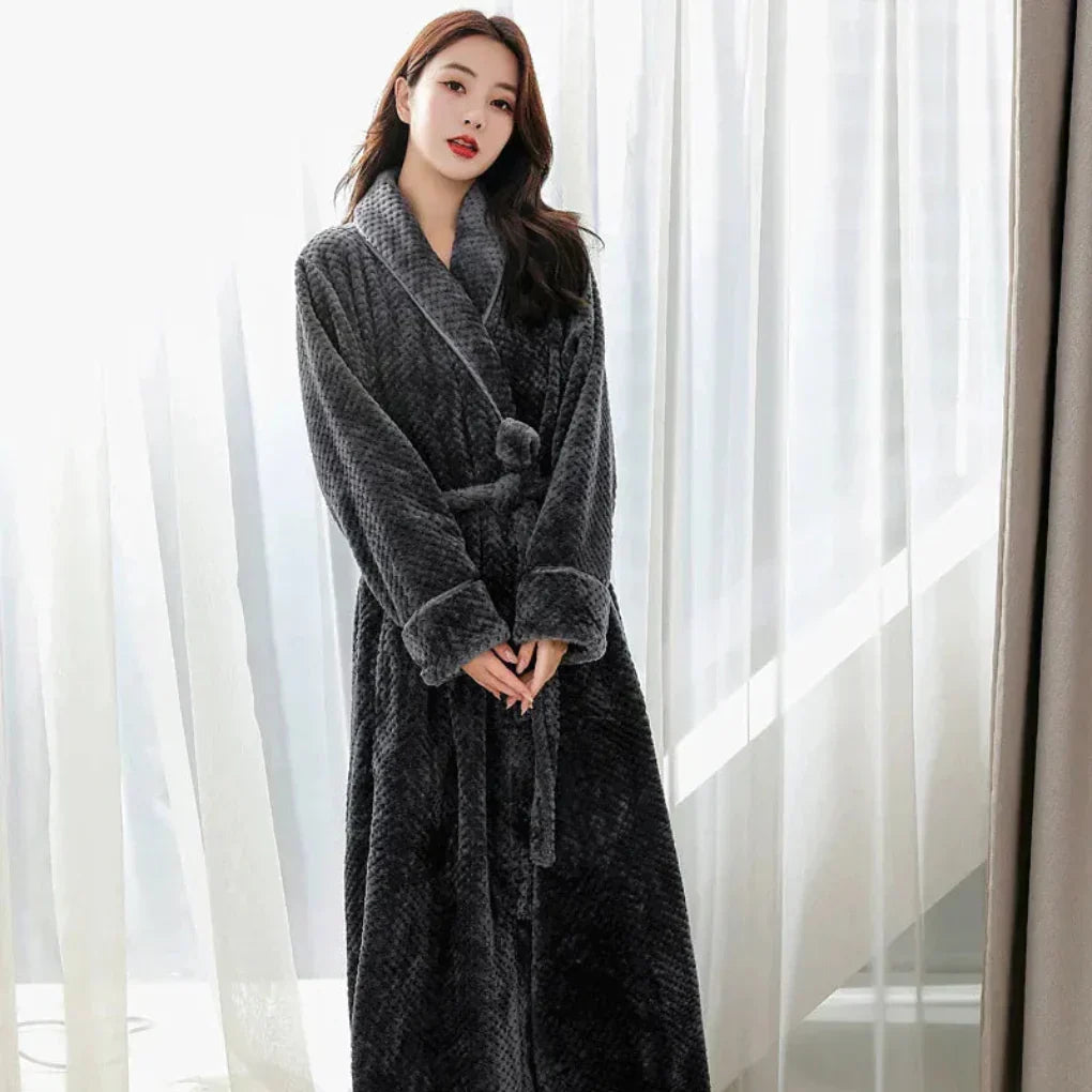 Soft women's plush hooded robe, offering cozy warmth and supreme comfort for loungewear or sleepwear.