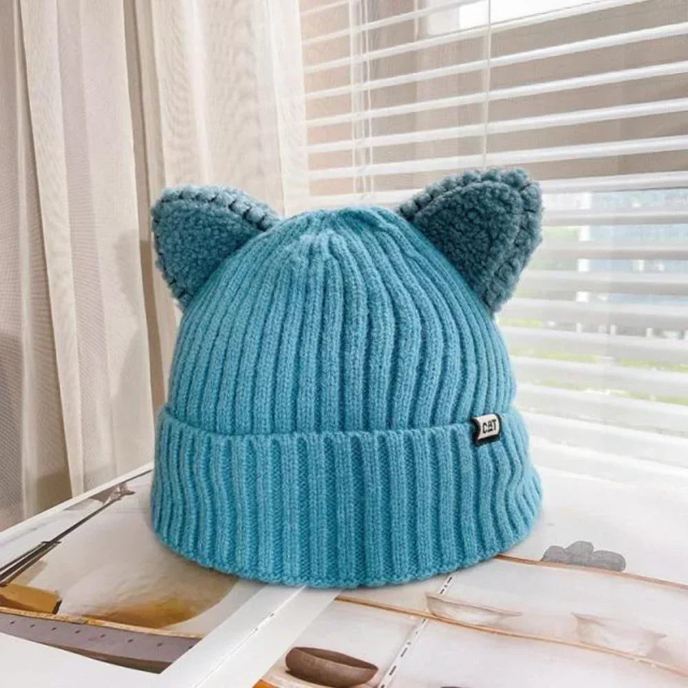 Cozy women's knitted cat ear hat. Stylish & warm winter beanie, a cute fashion accessory for cold days.