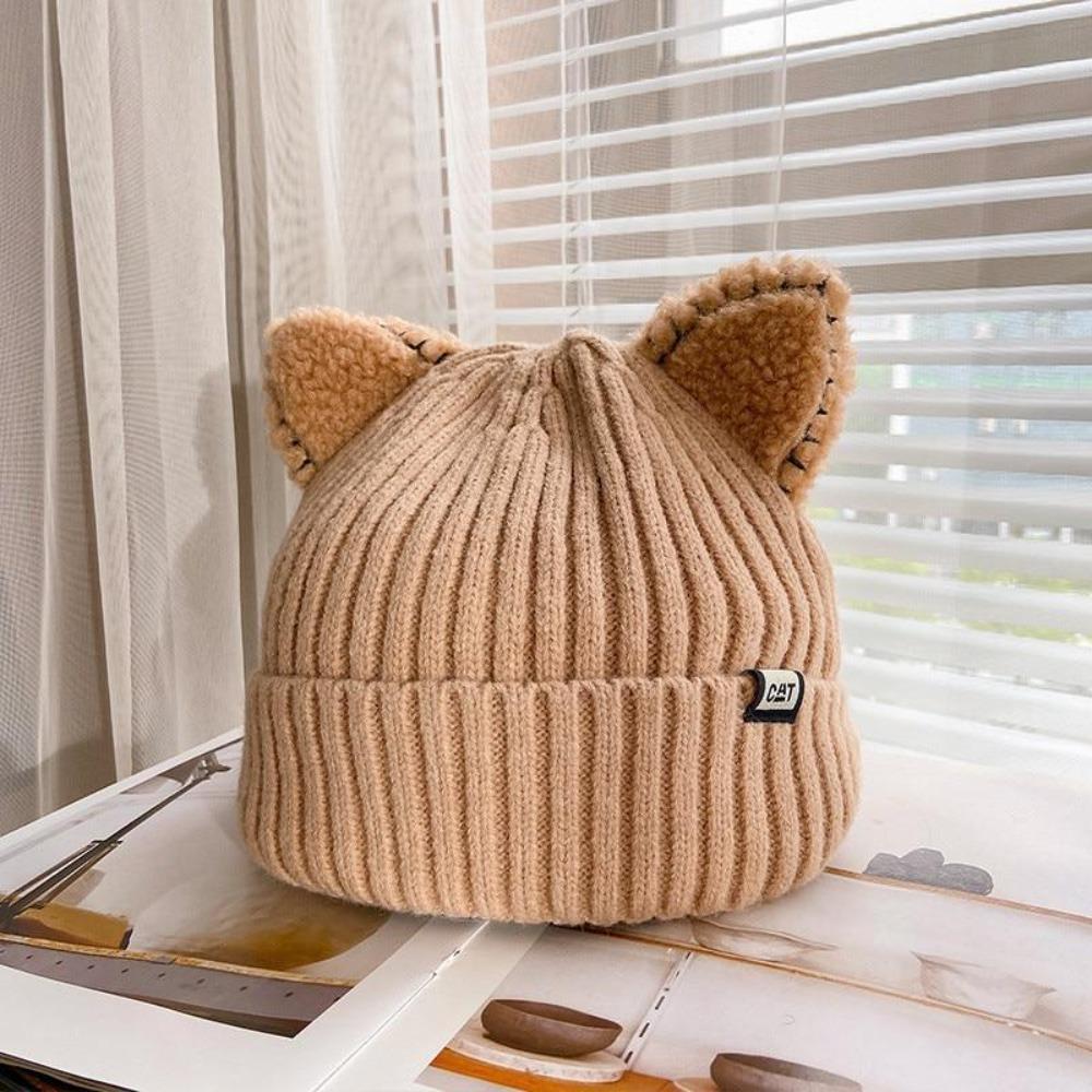 Warm knitted cat ear winter hat for women. Soft and cozy beanie, an adorable accessory for cold weather.