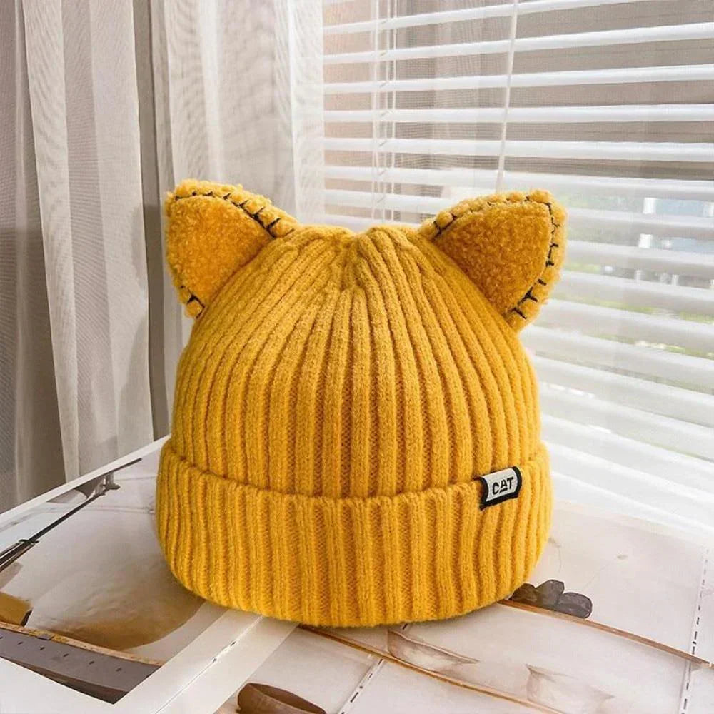 Cute women's cat ear knitted beanie. A cozy, soft winter hat, perfect for playful cold-weather fashion.