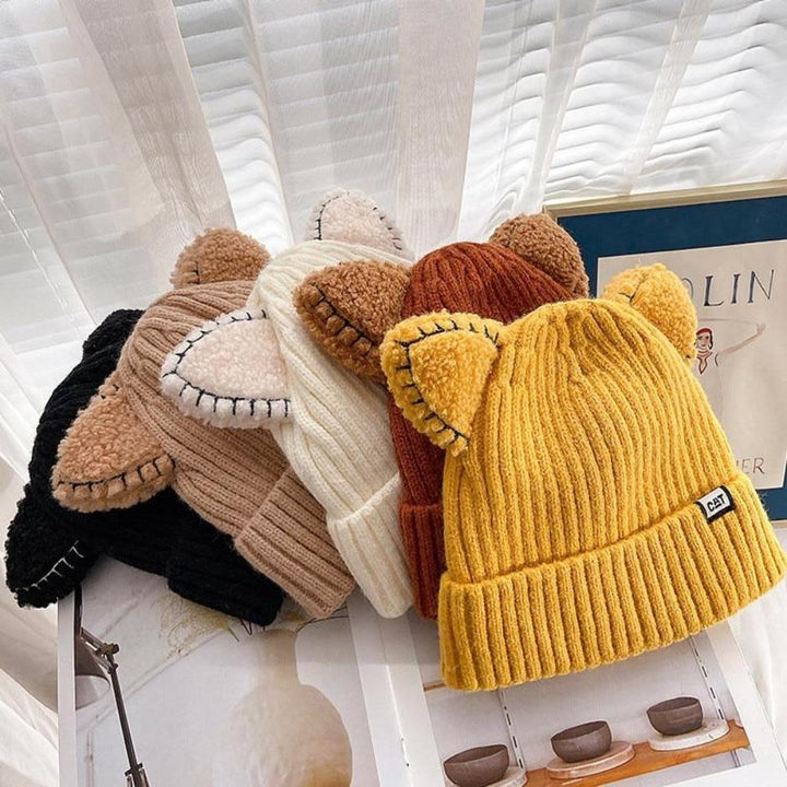 Chic women's knitted cat ear beanie. This cozy winter hat provides warmth and playful style for cold weather.