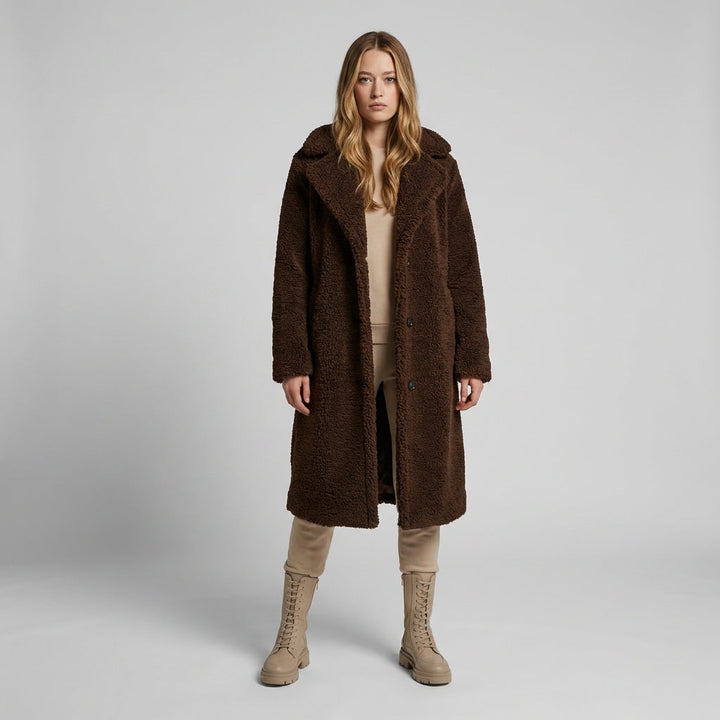 Women's cozy longline teddy coat in a warm shade, perfect for stylish winter fashion & comfort. Button-front, oversized fit.