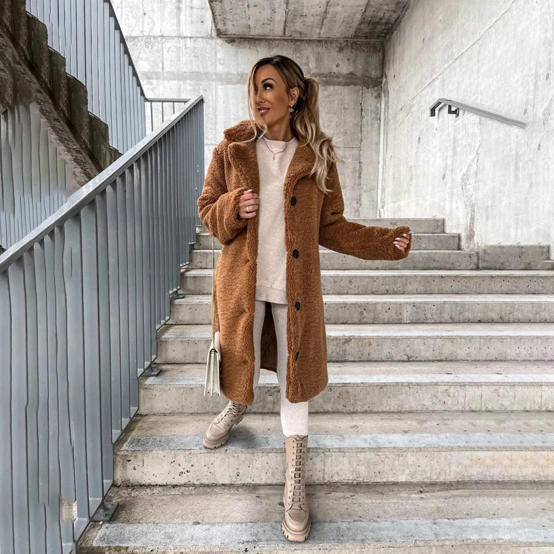 Oversized women's longline teddy coat with wide lapels & button front, offering a chic, warm, and comfortable winter look.