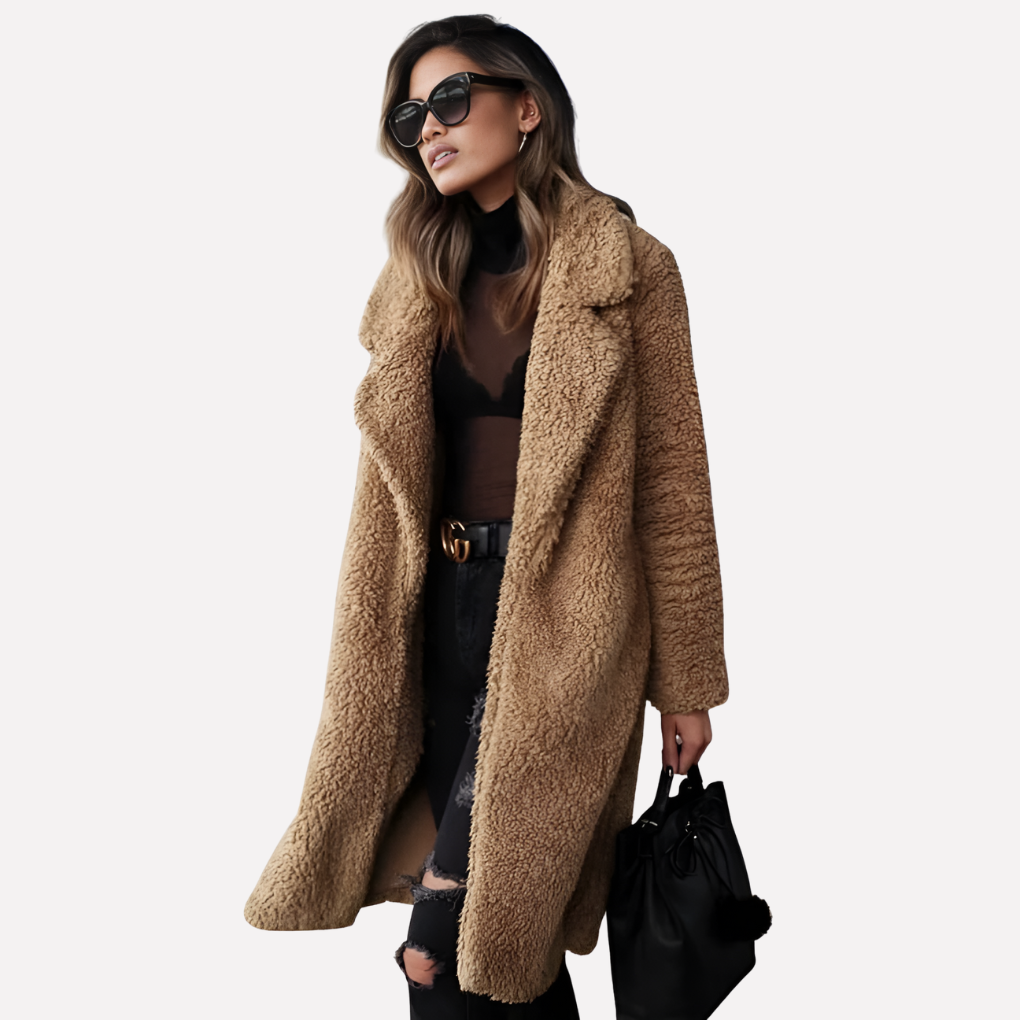 Chic woman wearing a plush longline teddy coat with a notched collar, styled for a cozy and fashionable winter look.