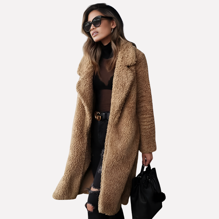 Chic woman wearing a plush longline teddy coat with a notched collar, styled for a cozy and fashionable winter look.