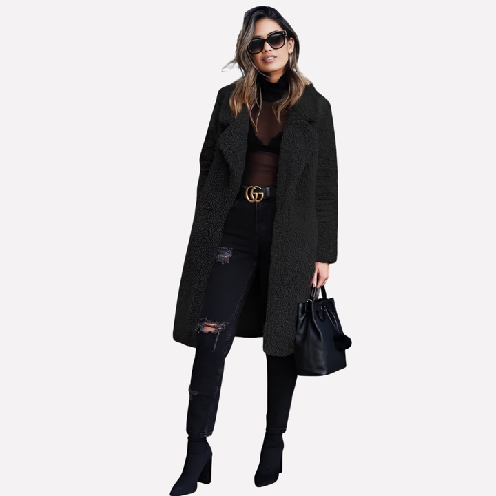 Close-up of a women's cozy longline teddy coat, highlighting the plush teddy fabric and sophisticated notched collar.